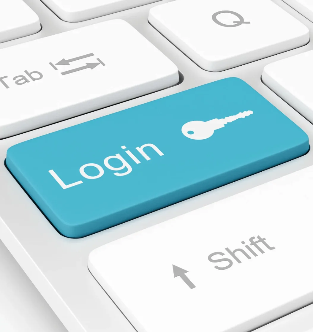 Branded Auth0 login experience on laptop and mobile keyboard